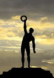 Silhouette of a man reaching up for a wreath demonstrating You Are Motivated By Pleasure