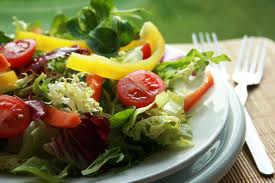 Healthy green salad representing Healthy Living, Eating and Exercise