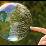 Finger touching bubble showing how to transform Beliefs Instantly
